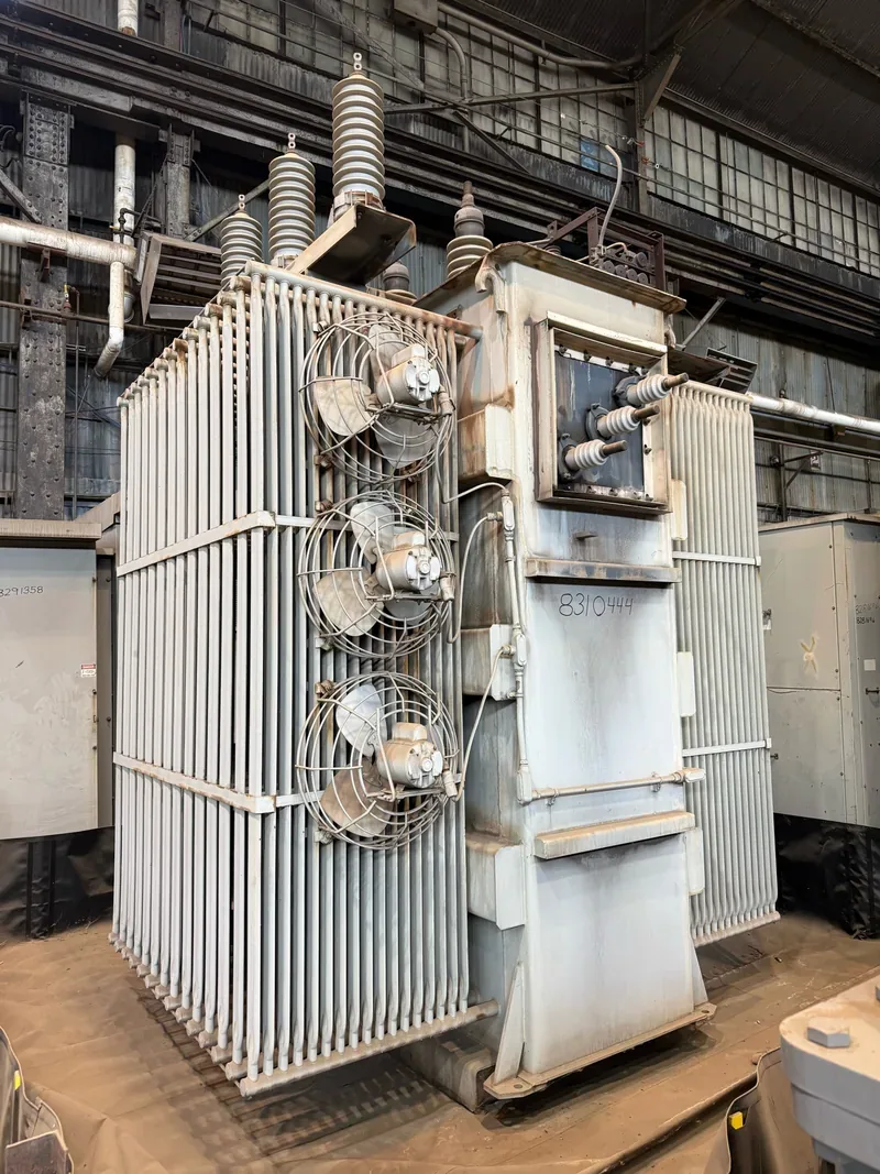 A large substation transformer with high-voltage bushings